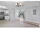 Open kitchen flows into living area, featuring stainless appliances and tile floors at 245 Amador Cir, Orlando, FL 32810