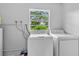 This laundry room features a washer and dryer at 245 Amador Cir, Orlando, FL 32810