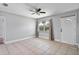 Bright and airy living room with tile flooring and ample natural light at 245 Amador Cir, Orlando, FL 32810