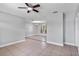 Bright living room featuring tile flooring and a ceiling fan at 245 Amador Cir, Orlando, FL 32810