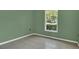 Bright bedroom featuring neutral walls, and natural light from the window at 250 Hickory Ave, Orange City, FL 32763