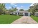 Lovely single-story home showcasing a well-kept lawn, a paved driveway, and a one-car garage at 250 Hickory Ave, Orange City, FL 32763