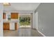 Bright kitchen featuring sliding glass doors to the backyard, tile floors, and plenty of space at 250 Hickory Ave, Orange City, FL 32763