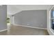 Spacious living room with tile flooring, vaulted ceilings, and natural light, creating an airy feel at 250 Hickory Ave, Orange City, FL 32763