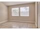 This bedroom features tiled floors, a window with blinds, and a closet at 2536 Woodgate Blvd # 202, Orlando, FL 32822
