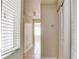 Hallway showing tiled floors, blinds and access to other rooms at 2536 Woodgate Blvd # 202, Orlando, FL 32822