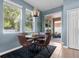 This breakfast nook features natural light, modern fixtures, a sliding glass door, and seating for four at 2762 Pepper Ln, Orlando, FL 32812
