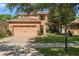 Charming two-story home featuring a manicured lawn, brick driveway, and a two-car garage at 2762 Pepper Ln, Orlando, FL 32812