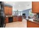 Bright kitchen with granite countertops, stainless appliances, and open to a cozy breakfast nook at 2762 Pepper Ln, Orlando, FL 32812