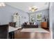 Open concept living room featuring hardwood floors, comfortable seating, and natural light at 2762 Pepper Ln, Orlando, FL 32812