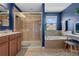 Elegant ensuite bathroom features a separate shower, a soaking tub, and a vanity area at 2762 Pepper Ln, Orlando, FL 32812