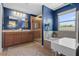 Beautiful ensuite bathroom with a separate shower, soaking tub, and double vanity sink at 2762 Pepper Ln, Orlando, FL 32812
