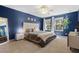 Spacious main bedroom features plush carpet, neutral décor, and abundant natural light at 2762 Pepper Ln, Orlando, FL 32812