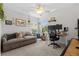 Inviting home office features a work station, plush carpet, and lots of natural light at 2762 Pepper Ln, Orlando, FL 32812