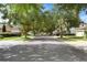 Street view of community featuring a paved road and tree-lined streets with well-maintained houses at 2762 Pepper Ln, Orlando, FL 32812