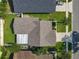 Overhead view of the home highlighting its roof, backyard, and proximity to neighboring houses and streets at 293 Drosdick Dr, Casselberry, FL 32707