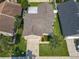 Aerial view of the property showcasing the home's layout, landscaping, and surrounding neighborhood at 293 Drosdick Dr, Casselberry, FL 32707