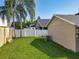 Spacious backyard with a well-maintained lawn and privacy fence, ideal for outdoor activities and entertaining at 293 Drosdick Dr, Casselberry, FL 32707