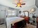 Bedroom with traditional decor, including a dark wood bed frame, dresser, and matching mirror at 293 Drosdick Dr, Casselberry, FL 32707
