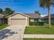 Charming single Gathering home with stone accents and a manicured lawn, perfect for a relaxing outdoor space at 293 Drosdick Dr, Casselberry, FL 32707