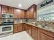 Modern kitchen design featuring granite countertops, stainless appliances, and custom cabinetry at 293 Drosdick Dr, Casselberry, FL 32707