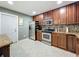 Spacious kitchen with stainless appliances and granite counters offers ample cooking space at 293 Drosdick Dr, Casselberry, FL 32707