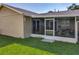 View of the screened patio featuring comfortable seating and providing a seamless indoor-outdoor living experience at 293 Drosdick Dr, Casselberry, FL 32707