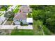 Aerial view of a home featuring a carport, green lawn, and mature trees at 309 Black Springs Ln, Winter Garden, FL 34787