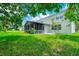A lush backyard with a screened lanai at 309 Black Springs Ln, Winter Garden, FL 34787