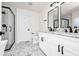 Modern bathroom featuring double vanity, marble floors, and glass shower at 309 Black Springs Ln, Winter Garden, FL 34787
