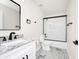Bathroom featuring a granite countertop vanity, an updated mirror, and a shower/tub combo at 309 Black Springs Ln, Winter Garden, FL 34787