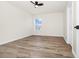 Bright bedroom with wood-look floors and a ceiling fan for added comfort at 309 Black Springs Ln, Winter Garden, FL 34787