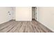 This bedroom boasts wood-look floors and a large closet for ample storage at 309 Black Springs Ln, Winter Garden, FL 34787