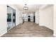 Modern kitchen featuring wood-look floors, neutral walls, and black appliances at 309 Black Springs Ln, Winter Garden, FL 34787