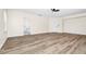 Spacious living room with wood-look floors and an ensuite bathroom at 309 Black Springs Ln, Winter Garden, FL 34787