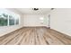 This living room features wood-look floors and bright, natural light at 309 Black Springs Ln, Winter Garden, FL 34787