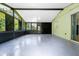 Bright sunroom with speckled concrete floors, an abundance of windows, and neutral walls at 309 Black Springs Ln, Winter Garden, FL 34787