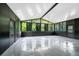 Bright sunroom featuring a vaulted ceiling, abundant windows, and speckled concrete floors at 309 Black Springs Ln, Winter Garden, FL 34787