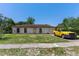 Modest single-story home with a small front yard and attached garage, awaiting personalized updates at 315 Panama Cir, Winter Springs, FL 32708