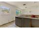 Outdated kitchen with double sink and a view from the window to the exterior at 315 Panama Cir, Winter Springs, FL 32708