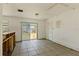 Sunlit living area featuring tile floor, sliding glass doors to the backyard, and a utility closet at 315 Panama Cir, Winter Springs, FL 32708