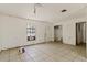 Bright living room featuring tile flooring, an exterior door, and a window with natural light at 315 Panama Cir, Winter Springs, FL 32708