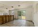 Open-concept area featuring tile floors, a bar structure, and sliding glass doors to backyard at 315 Panama Cir, Winter Springs, FL 32708