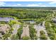 Aerial view of the community, lake, and trees at 3309 Wilshire Way Rd # 3, Orlando, FL 32829