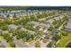 Aerial shot of houses in a wooded community with a lake at 3309 Wilshire Way Rd # 3, Orlando, FL 32829