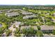 Community aerial view showcasing lush greenery, multiple buildings, and convenient parking at 3309 Wilshire Way Rd # 3, Orlando, FL 32829