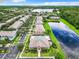 Gorgeous aerial view of a residential neighborhood with a community pool and a beautiful lake at 3309 Wilshire Way Rd # 3, Orlando, FL 32829