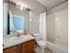Clean bathroom with wood vanity, shower and bathtub combo at 3309 Wilshire Way Rd # 3, Orlando, FL 32829