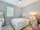 Serene bedroom features neutral tones, plush bedding, and natural light at 3309 Wilshire Way Rd # 3, Orlando, FL 32829