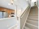 Updated kitchen with stainless steel appliances and an adjacent staircase at 3309 Wilshire Way Rd # 3, Orlando, FL 32829
